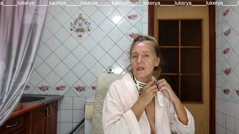 Sexy hostess Lukerya cooks in her robe with all her curves on display